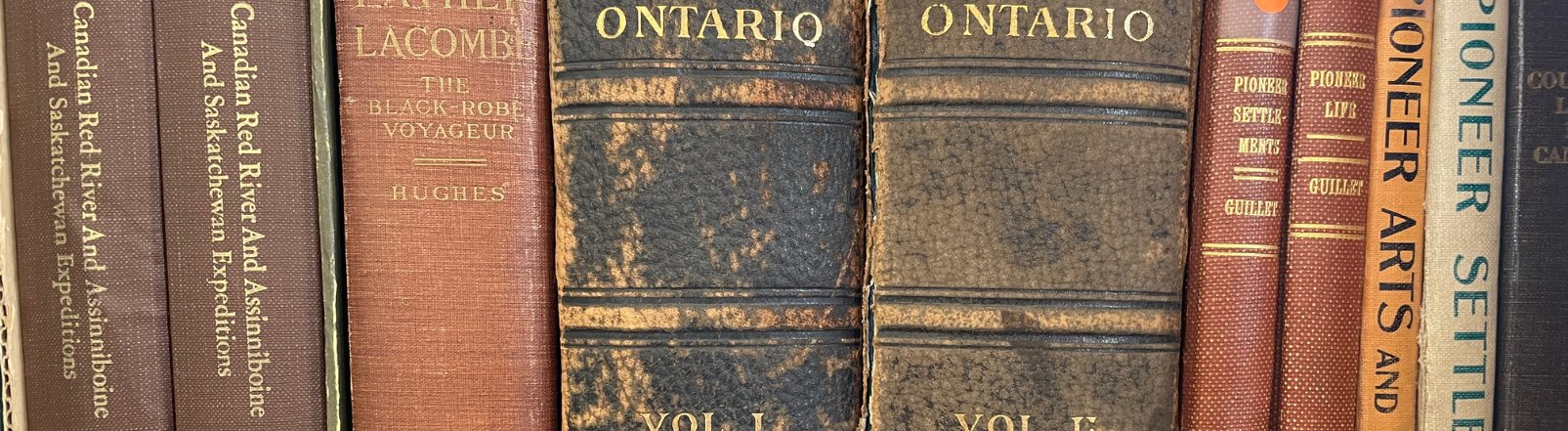 Old books stacked side by side